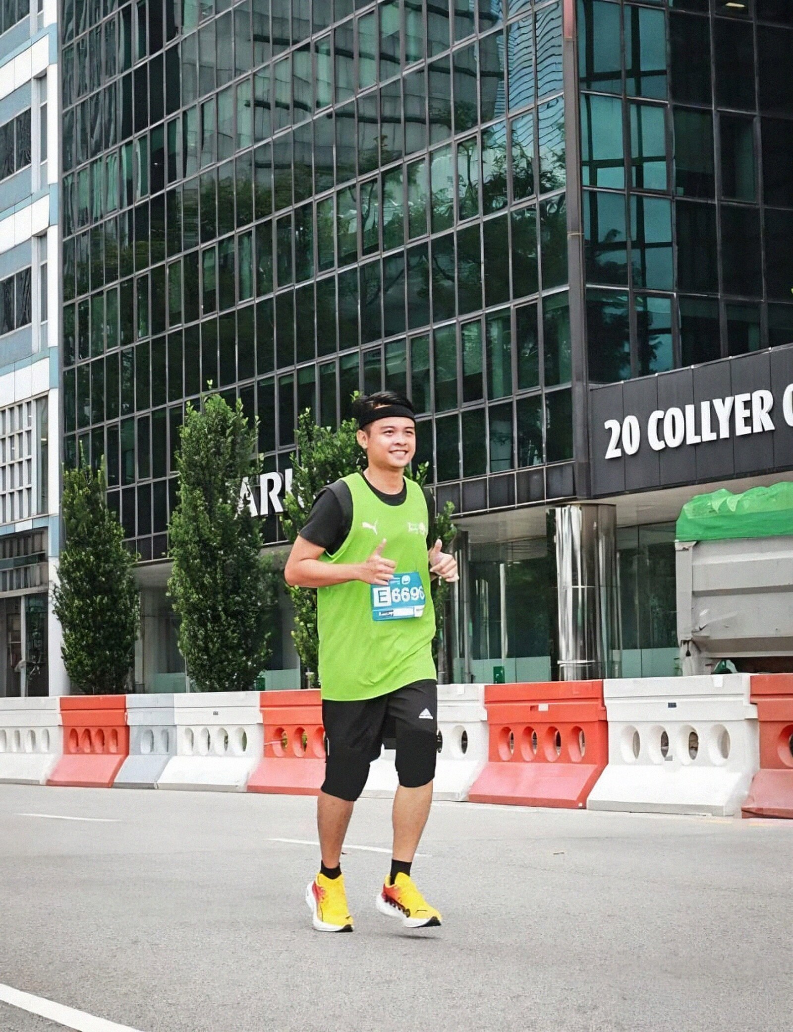 A Fit Lab SG member running a road race in the Singapore CBD